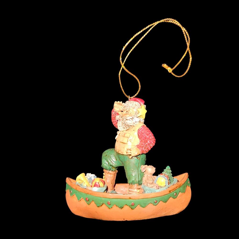 1994 Wang's Santa Canoe Christmas Ornament Resin Holiday Decor